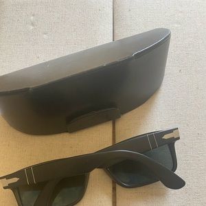 Italian designer sunglasses by Persol with case.